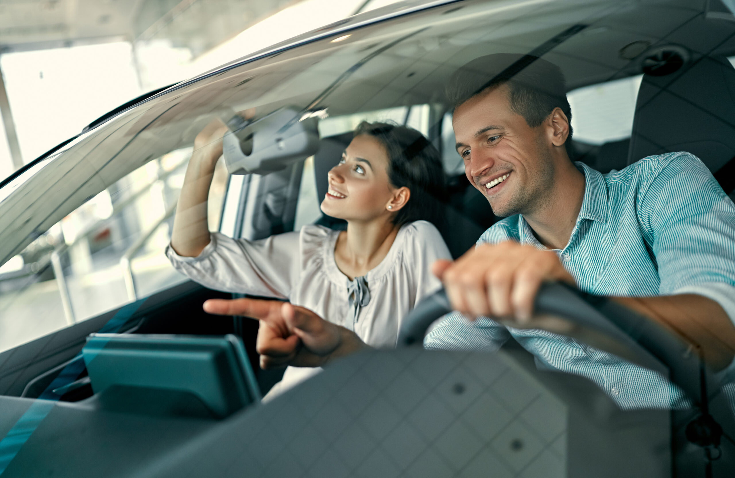 Canadian driver at dealership finalizing vehicle purchase