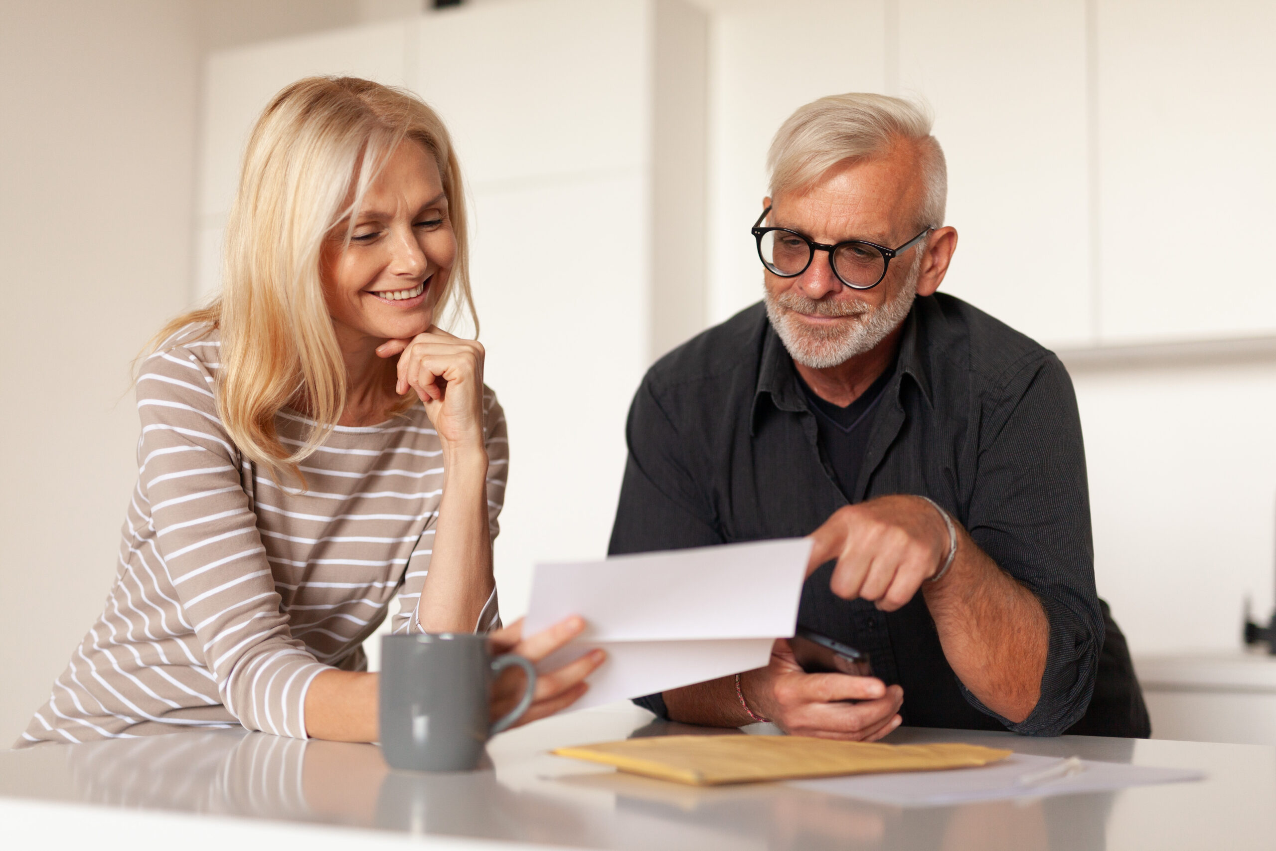 Couple reviewing monthly payment plan with dealer